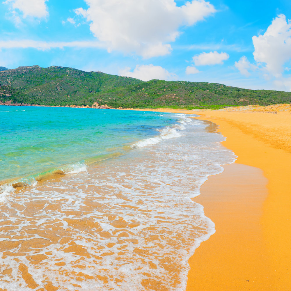 porto-ferro-sardinia-colored sand beach